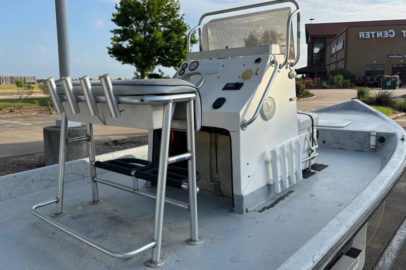 Slide: The Image of Small boat with a white console and seating, Destiny model, 2001, parked outdoors. - 4