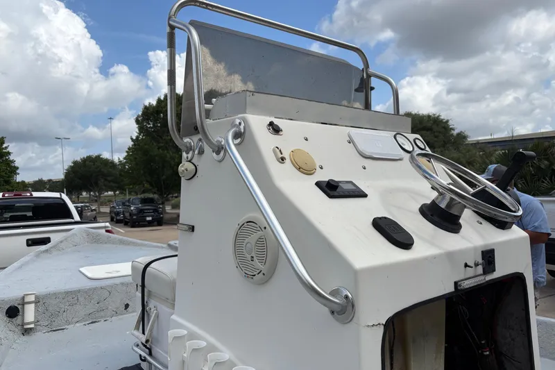 Slide: The Image of Center console of a 2001 Destiny boat under a cloudy sky. - 9