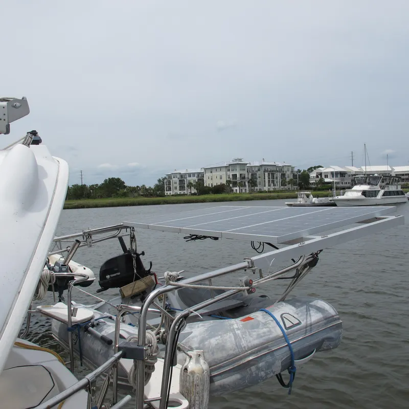 Slide: The Image of Sailboat with solar panels and dinghy on water, Hunter 410, 1998 model. - 20