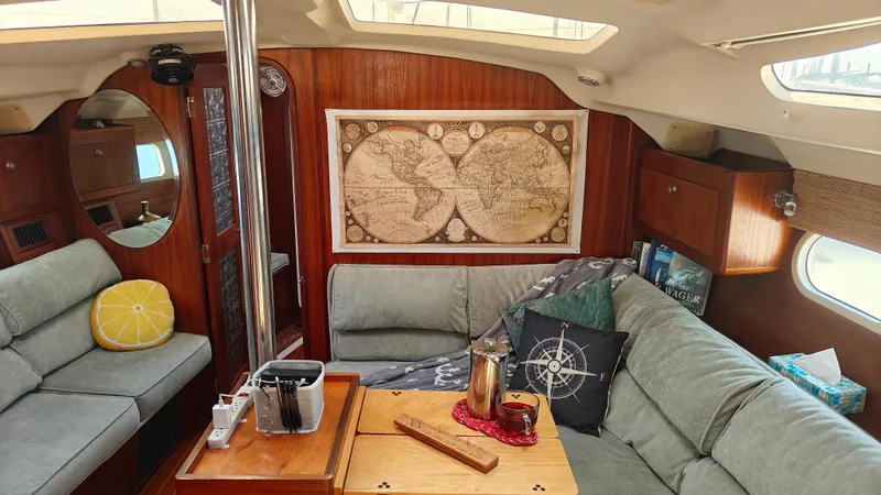 Slide: The Image of Cozy interior of 1998 Hunter 410 sailboat with map decor and comfortable seating. - 37