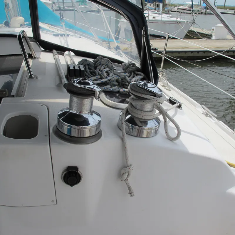 Slide: The Image of Sailboat deck with winches and ropes, Hunter 410, 1998 model, docked at marina. - 9