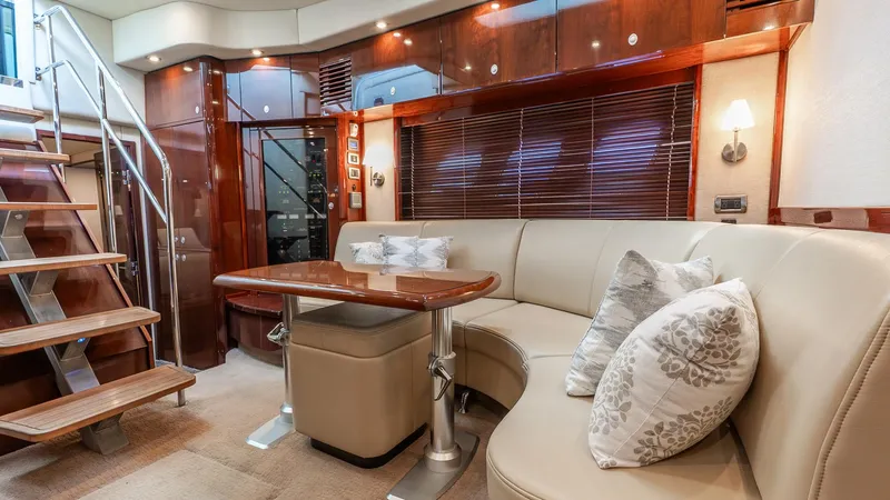 Slide: The Image of Luxurious interior of 2008 Sea Ray Sundancer yacht with elegant seating and wooden finishes. - 12