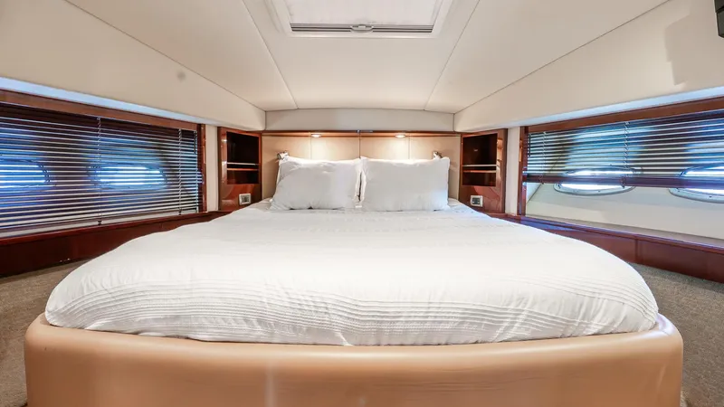 Slide: The Image of Luxurious bedroom interior of 2008 Sea Ray Sundancer yacht with elegant bedding and wood accents. - 16