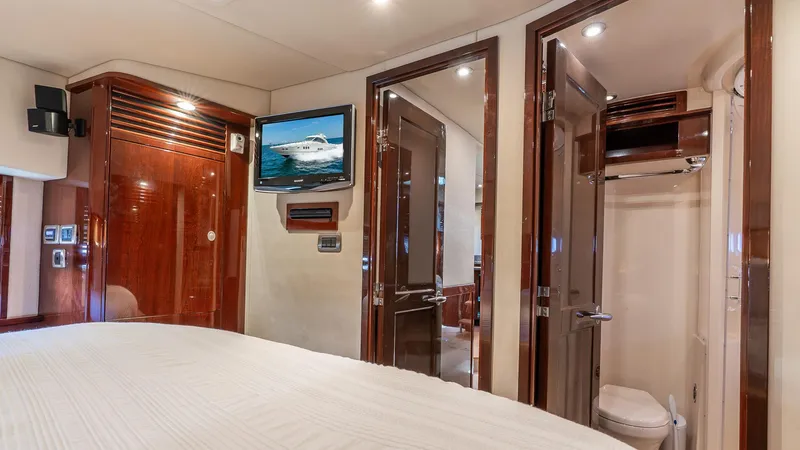 Slide: The Image of Luxurious 2008 Sea Ray Sundancer yacht interior with wood finishes and modern amenities. - 17