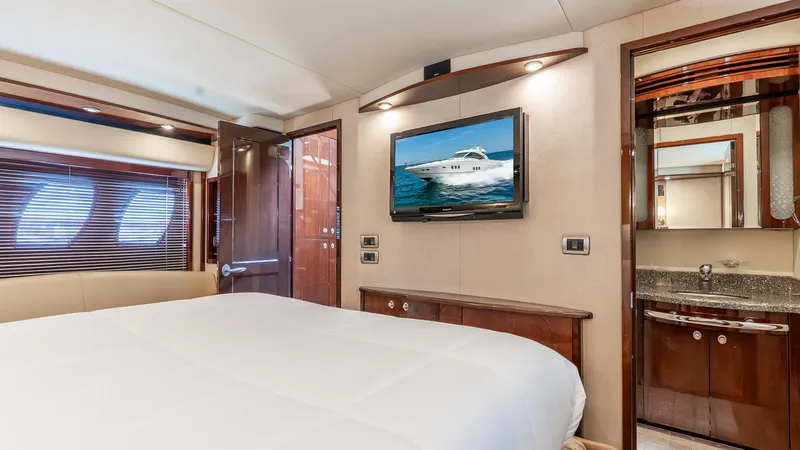 Slide: The Image of Luxurious 2008 Sea Ray Sundancer yacht bedroom with TV and ensuite bathroom. - 24