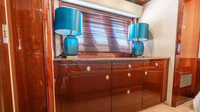 Slide: The Image of Luxurious interior of 2008 Sea Ray Sundancer with elegant wood cabinetry and blue lamps. - 25