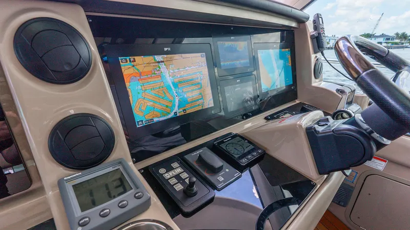 Slide: The Image of 2008 Sea Ray Sundancer helm with navigation screens and controls. - 28