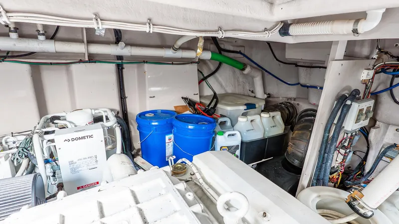 Slide: The Image of Engine room of 2008 Sea Ray Sundancer with equipment and storage barrels. - 30