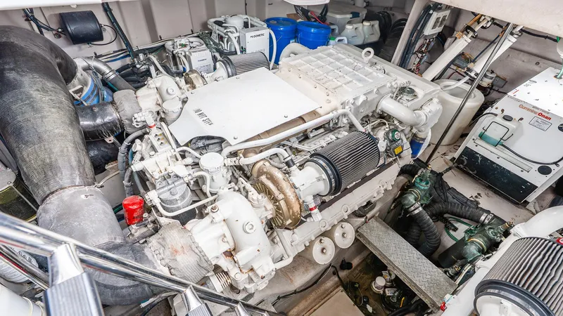 Slide: The Image of Engine room of a 2008 Sea Ray Sundancer boat, showcasing mechanical components. - 32