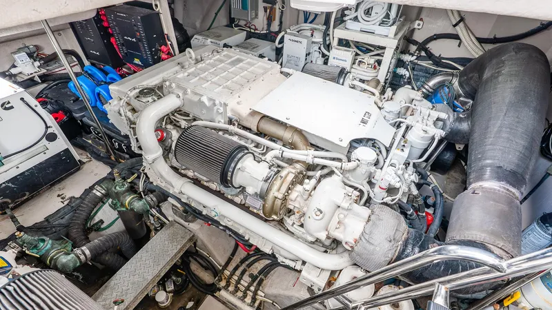 Slide: The Image of Engine room of a 2008 Sea Ray Sundancer, showcasing complex machinery and components. - 33