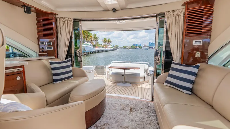 Slide: The Image of Luxurious interior of a 2008 Sea Ray Sundancer yacht with waterfront view. - 8