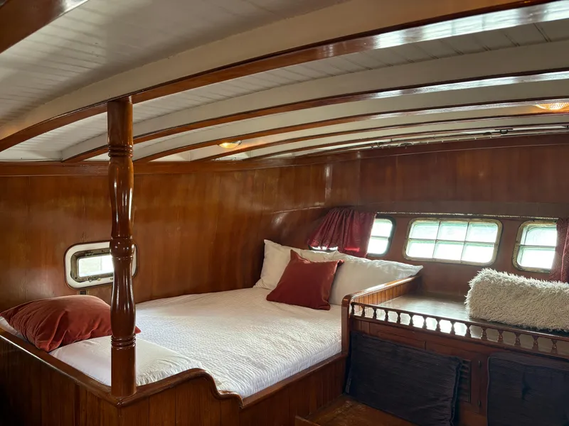 Slide: The Image of Cozy cabin interior of 1975 Formosa 51 yacht with wooden finish and comfortable bedding. - 17