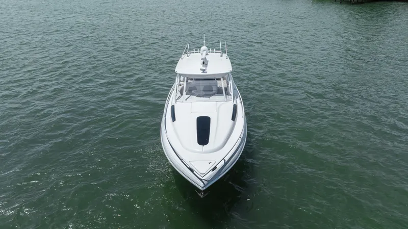 Slide: The Image of 2013 Intrepid 400 Cuddy boat on open water, front view. - 12