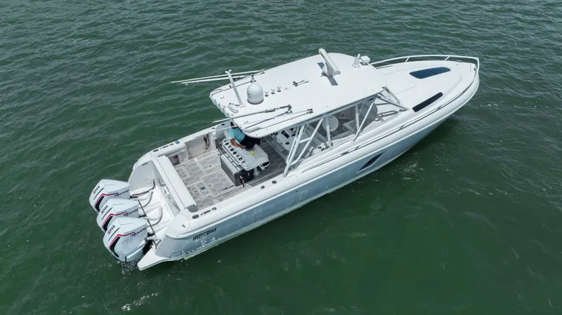 Slide: The Image of 2013 Intrepid 400 Cuddy boat on open water, aerial view. - 17