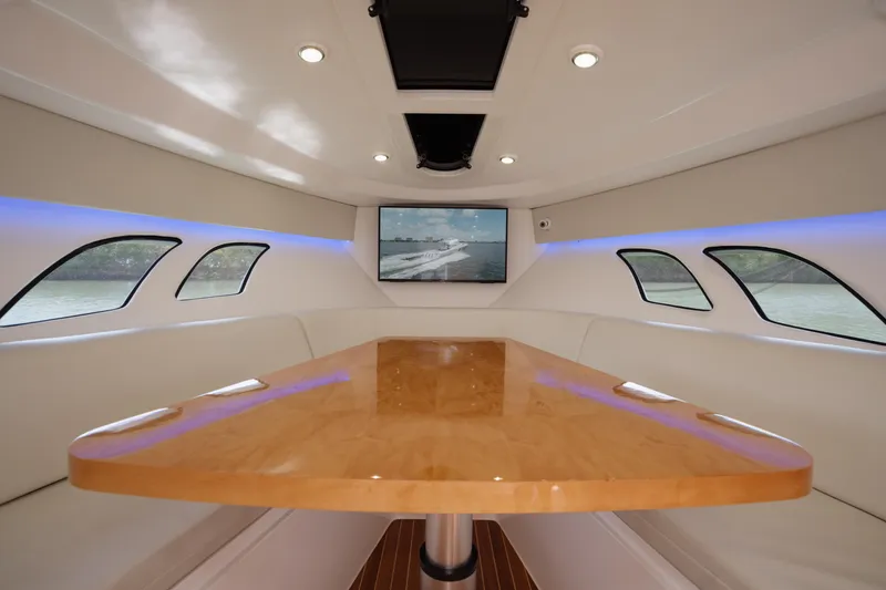 Slide: The Image of Interior of 2013 Intrepid 400 Cuddy with sleek table and modern design. - 20