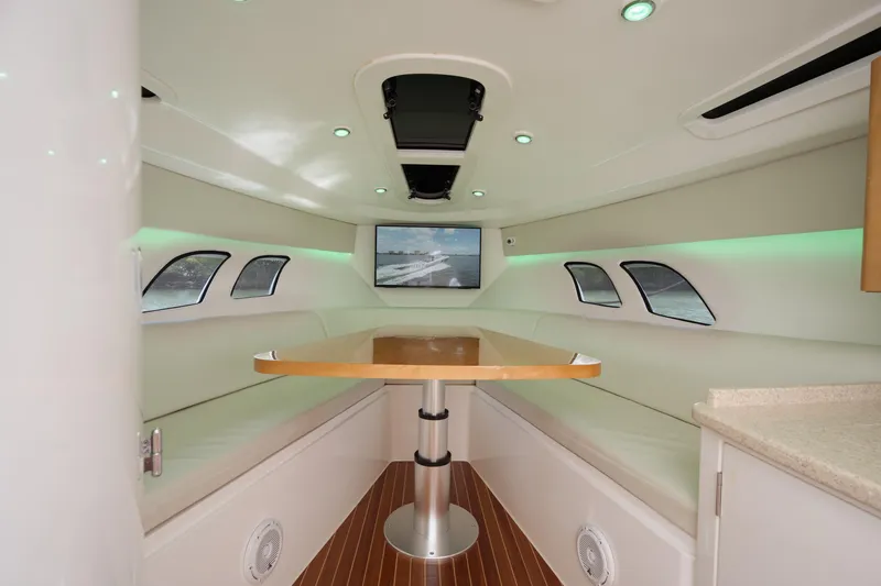 Slide: The Image of Interior of 2013 Intrepid 400 Cuddy boat with modern seating and table. - 22