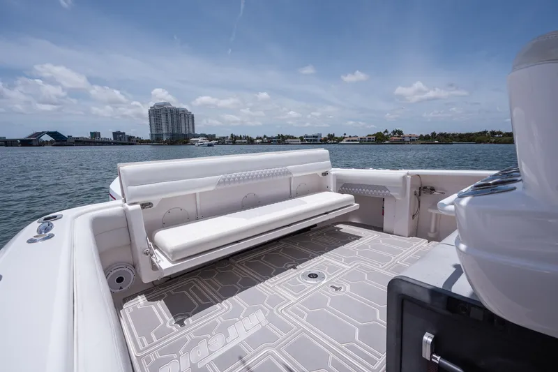 Slide: The Image of 2013 Intrepid 400 Cuddy boat with spacious seating and scenic waterfront view. - 40