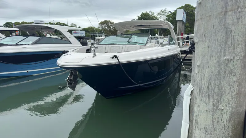 The Image of 2020 Sea Ray SLX 400 boat docked in marina, featuring sleek design and modern amenities. - 0