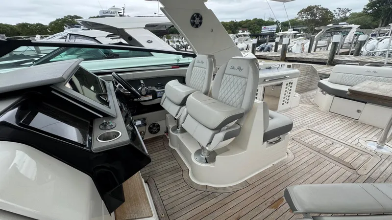 Slide: The Image of 2020 Sea Ray SLX 400 boat interior with luxurious seating and modern dashboard. - 12