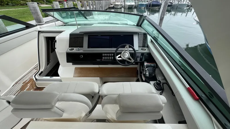 Slide: The Image of 2020 Sea Ray SLX 400 helm with modern controls and dual seating. - 13