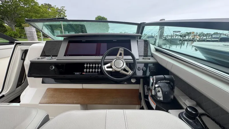 Slide: The Image of 2020 Sea Ray SLX 400 helm with modern controls and sleek design. - 14