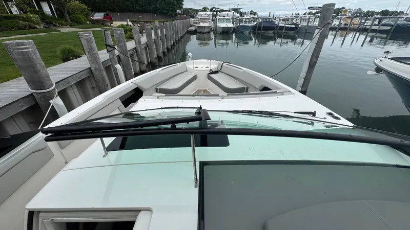 Slide: The Image of 2020 Sea Ray SLX 400 boat docked at marina, view from helm. - 15