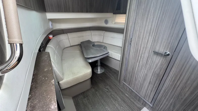 Slide: The Image of 2020 Sea Ray SLX 400 interior with modern seating and table. - 16