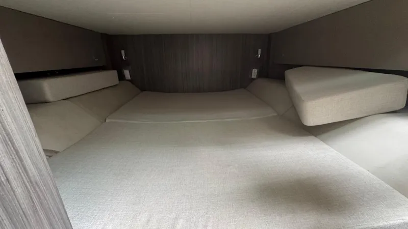 Slide: The Image of Interior cabin of 2020 Sea Ray SLX 400, featuring spacious sleeping area. - 18