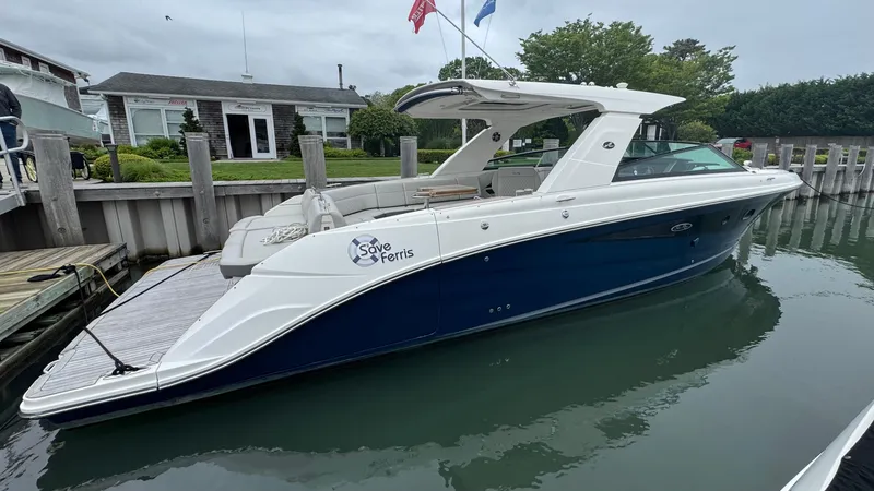 Slide: The Image of 2020 Sea Ray SLX 400 boat docked, featuring sleek design and modern amenities. - 3