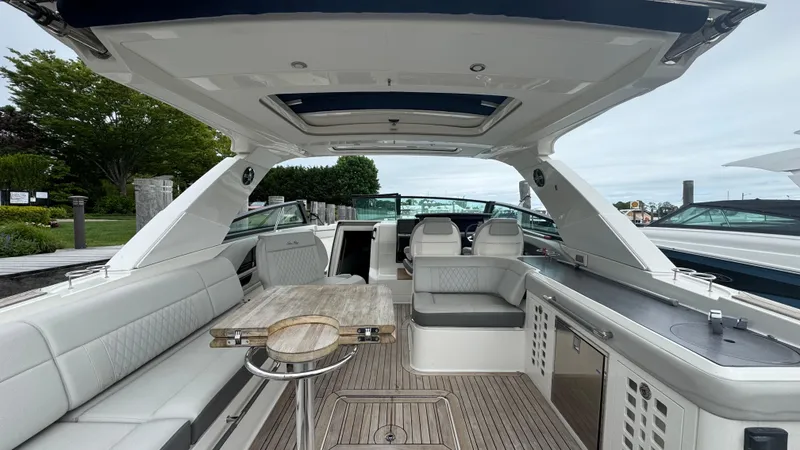 Slide: The Image of 2020 Sea Ray SLX 400 boat interior with luxurious seating and modern amenities. - 9