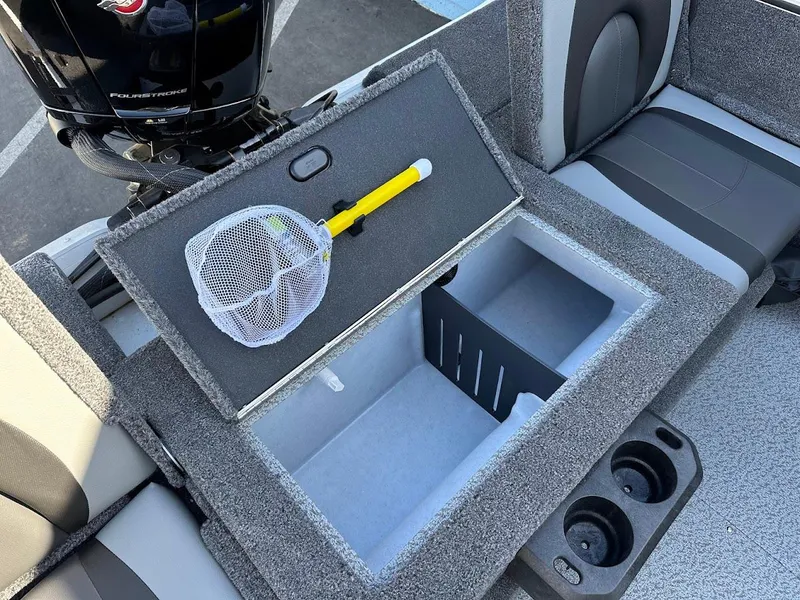 Slide: The Image of 2025 Lund 1875 Crossover XS boat storage compartment with net and cup holders. - 17