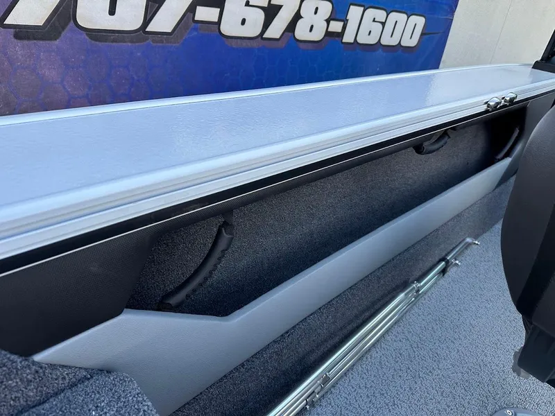 Slide: The Image of 2025 Lund 1875 Crossover XS interior storage compartment with sleek design and durable materials. - 31