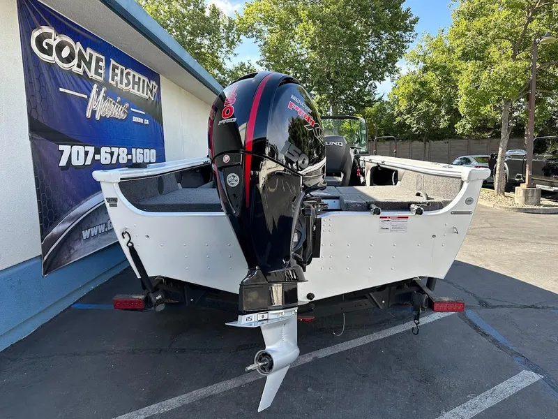 Slide: The Image of 2025 Lund 1875 Crossover XS boat with Mercury 150 engine at dealership. - 8