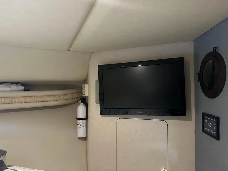 Slide: The Image of Interior of 1997 Regal Commodore 402 with TV and fire extinguisher. - 42