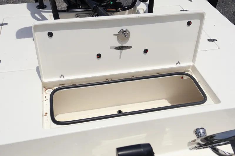Slide: The Image of Open storage compartment on 2025 Hewes Redfisher 18 boat. - 18