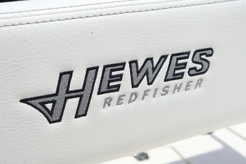 Slide: The Image of 2025 Hewes Redfisher 18 boat interior with cooler and seating. - 20