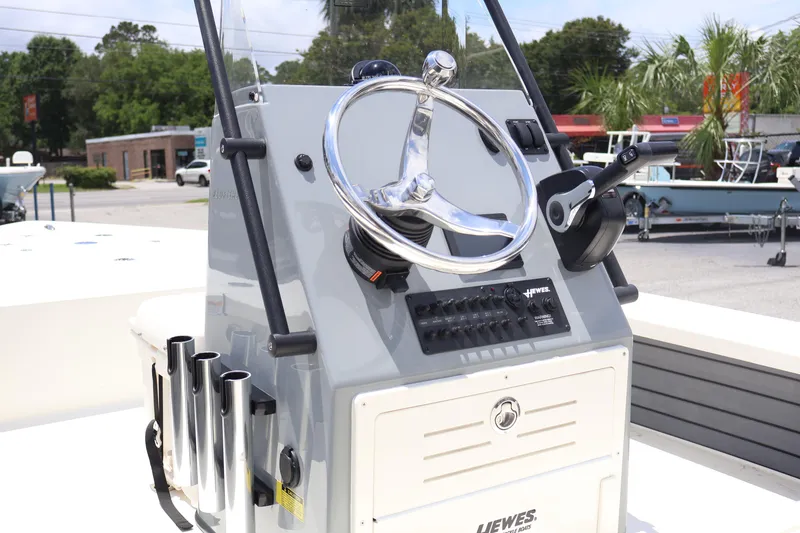 Slide: The Image of 2025 Hewes Redfisher 18 boat console with steering wheel and controls. - 6