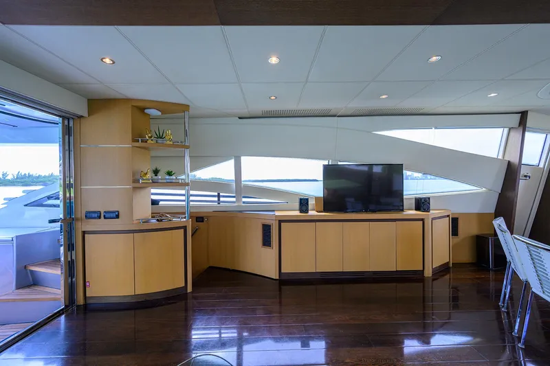 Slide: The Image of Luxurious interior of 2009 Pershing 90 Express yacht with modern furnishings and large windows. - 10