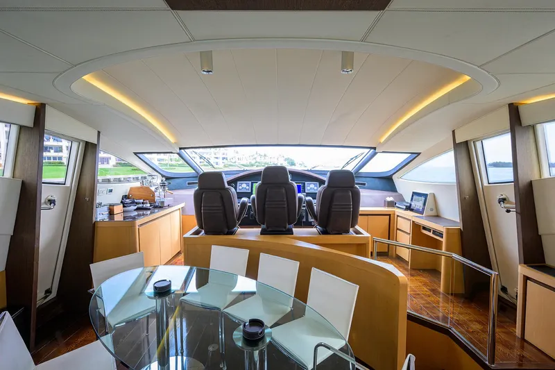 Slide: The Image of Interior of 2009 Pershing 90 Express yacht with modern helm and dining area. - 13