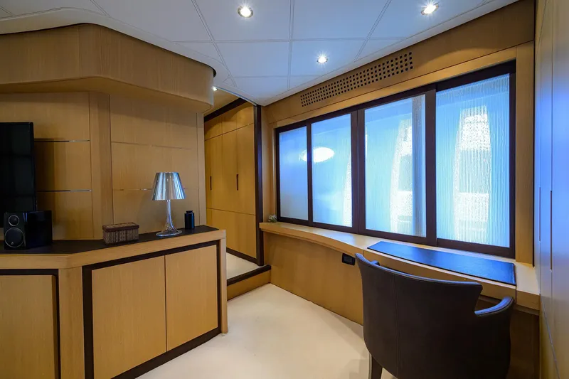 Slide: The Image of Luxurious interior of 2009 Pershing 90 Express yacht with modern furnishings and large windows. - 19
