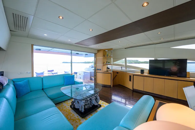 Slide: The Image of Luxurious interior of 2009 Pershing 90 Express yacht with modern furnishings and large windows. - 2