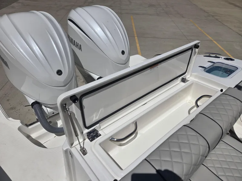 Slide: The Image of 2025 Pursuit S 288 Sport boat with dual Yamaha engines and cushioned seating. - 12