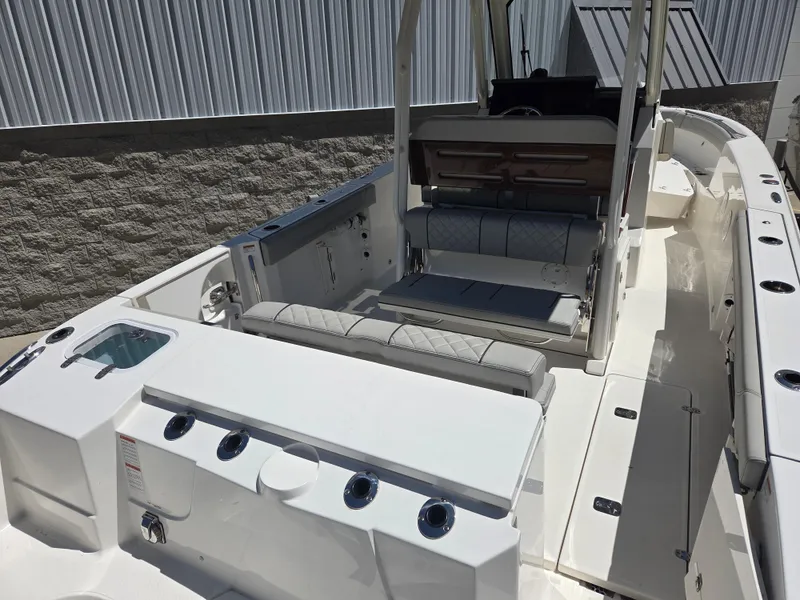 Slide: The Image of 2025 Pursuit S 288 Sport boat interior with seating and storage compartments. - 14