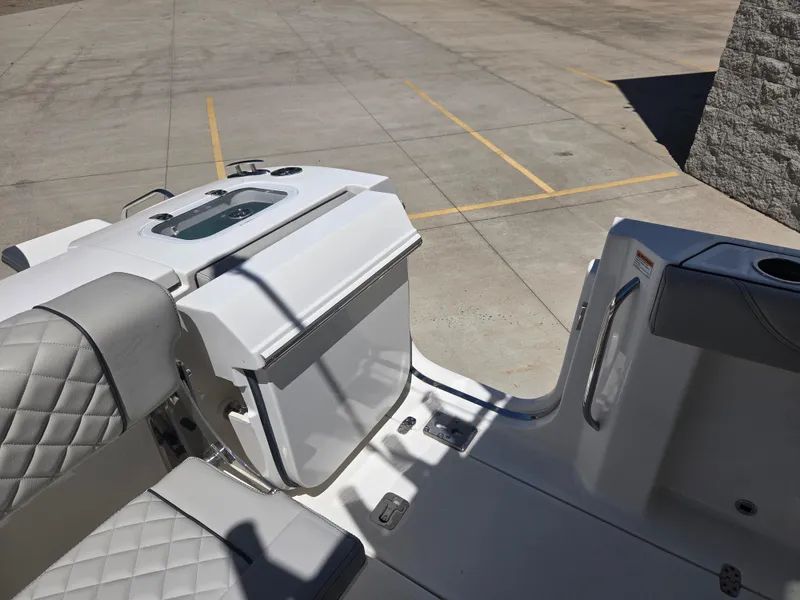 Slide: The Image of 2025 Pursuit S 288 Sport boat interior with seating and storage features. - 16