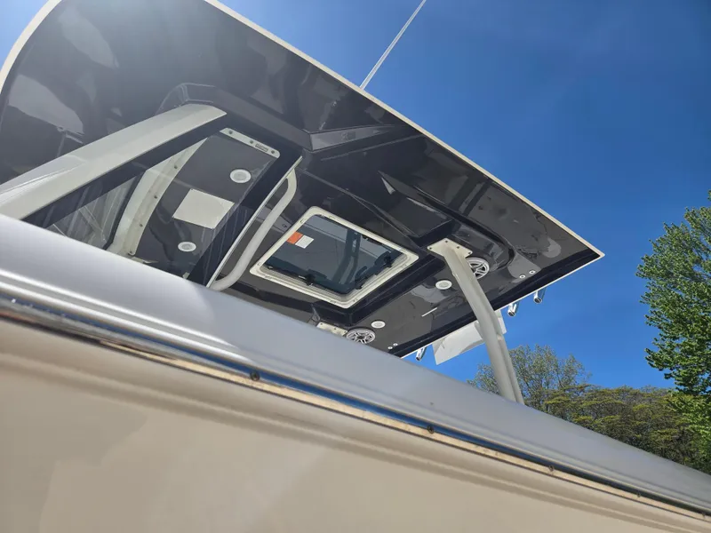 Slide: The Image of 2025 Pursuit S 288 Sport boat, viewed from below, showcasing sleek design and modern features. - 17