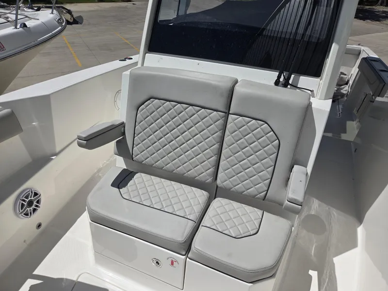 Slide: The Image of 2025 Pursuit S 288 Sport boat with gray quilted seating. - 21