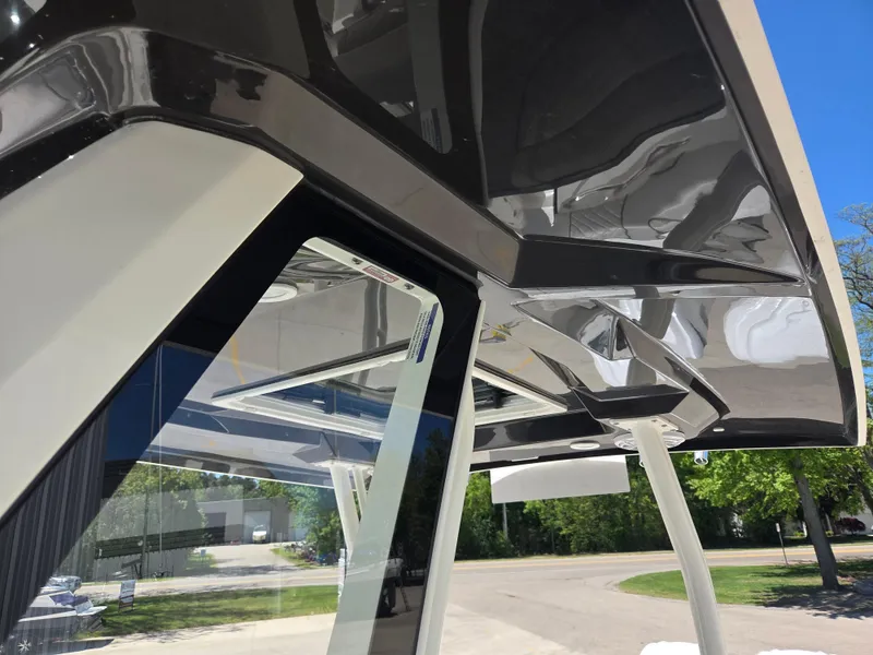 Slide: The Image of 2025 Pursuit S 288 Sport boat with sleek, modern design and reflective surfaces. - 25