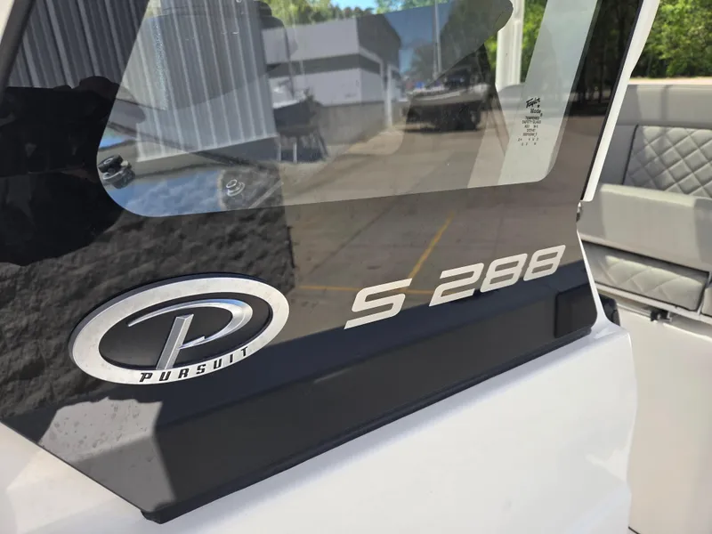 Slide: The Image of 2025 Pursuit S 288 Sport boat, close-up of logo and model name on the side. - 26