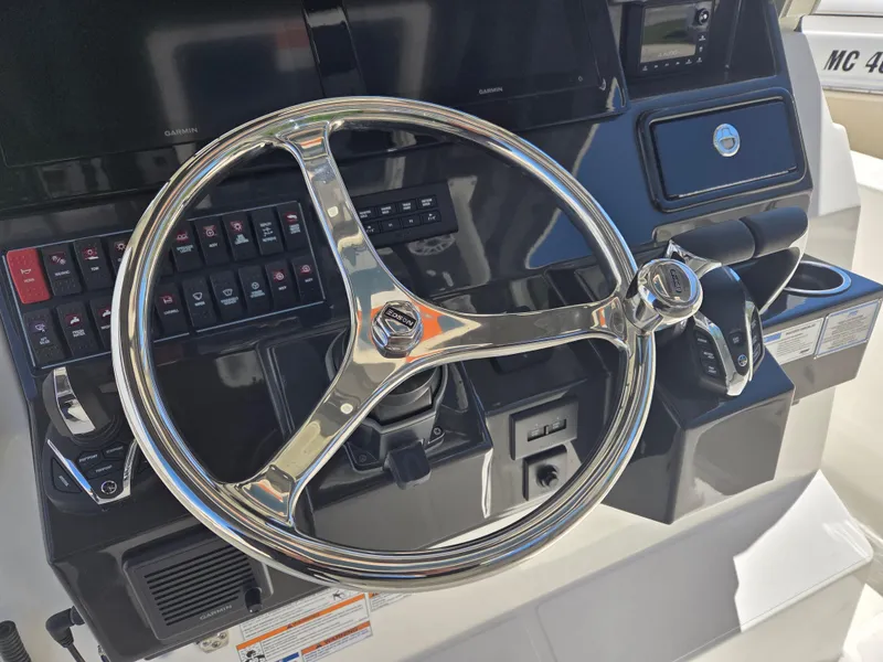 Slide: The Image of Steering wheel of 2025 Pursuit S 288 Sport boat with control panel. - 29