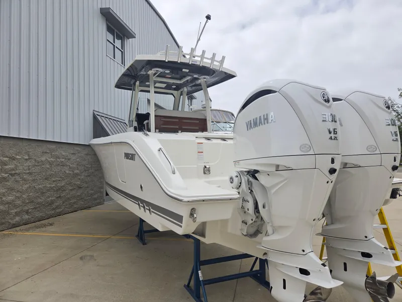 Slide: The Image of 2025 Pursuit S 288 Sport boat with dual Yamaha engines, displayed outdoors. - 3